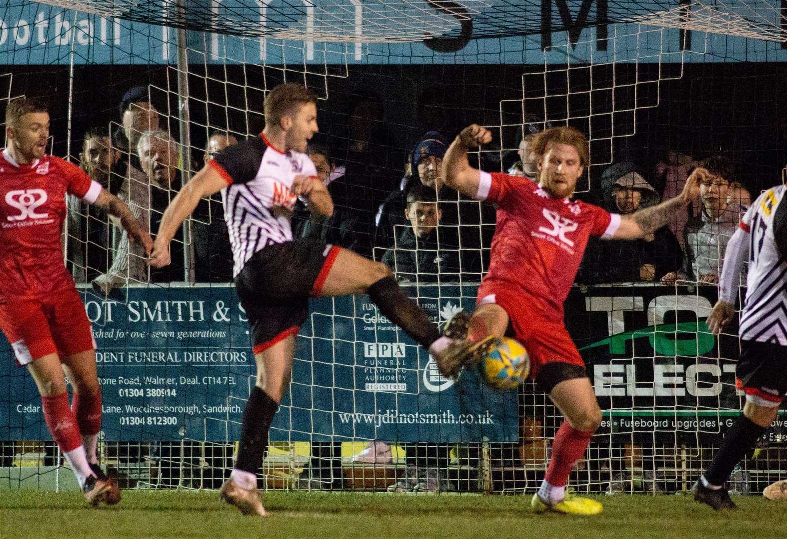 Aaron Millbank beats Faversham defender Finn O'Mara to get the Hoops' second. Picture: Paul Willmott