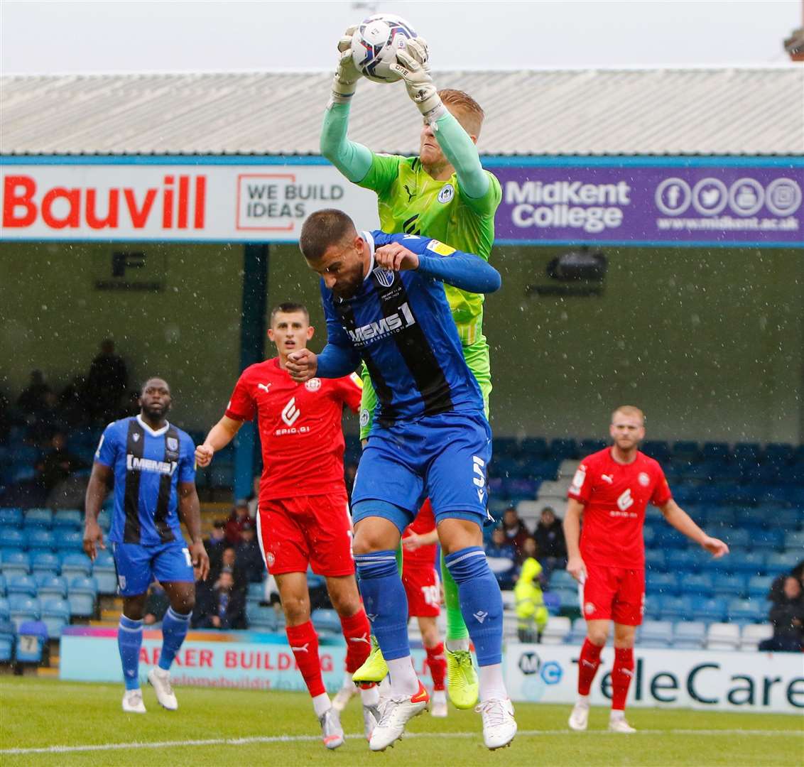 Max Ehmer beaten to the ball by Wigan's Ben Amos. Picture: Andy Jones