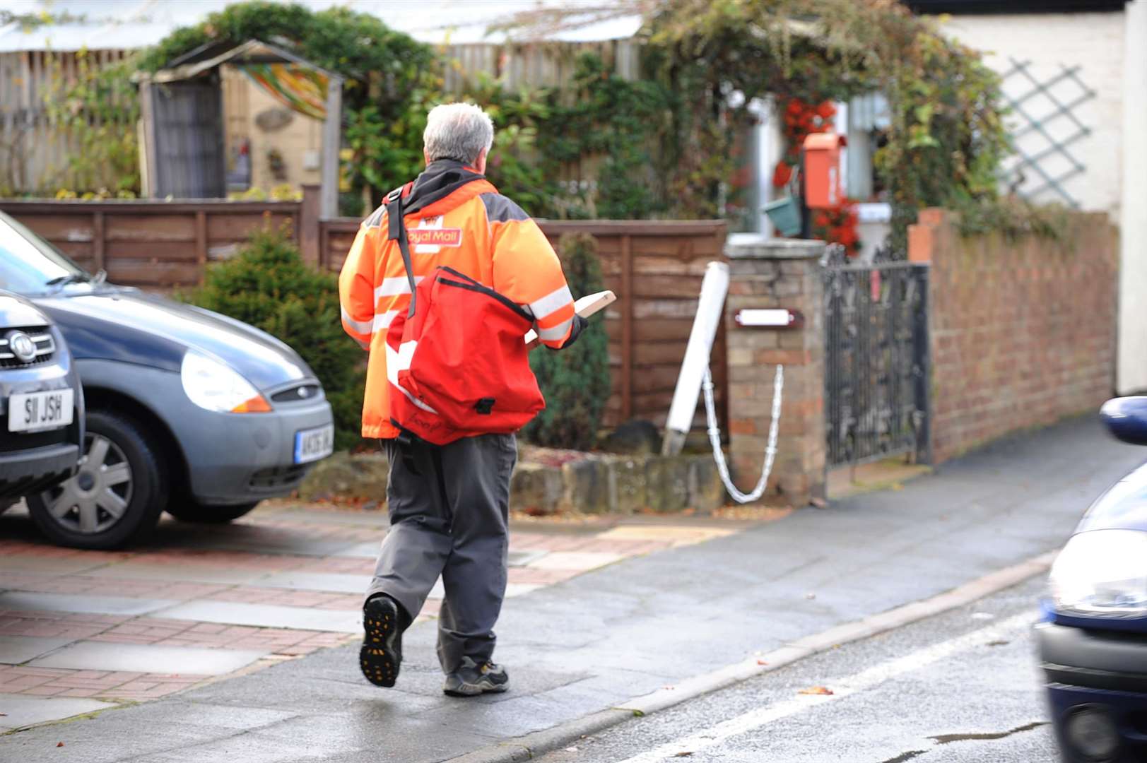 Royal Mail postman in North Street, Stanground. (2676746)