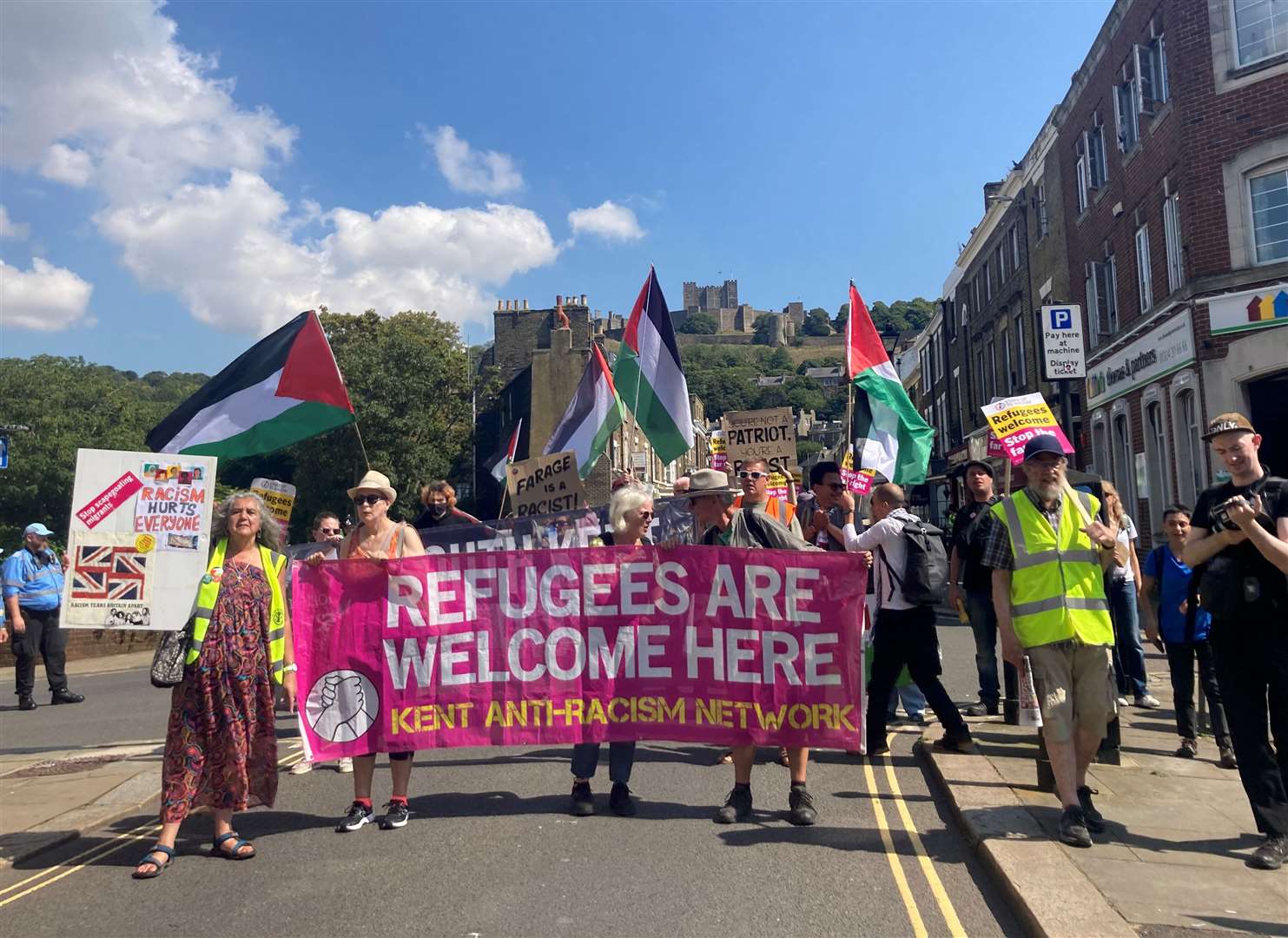 Pro-immigration groups marching to the backdrop of Dover Castle