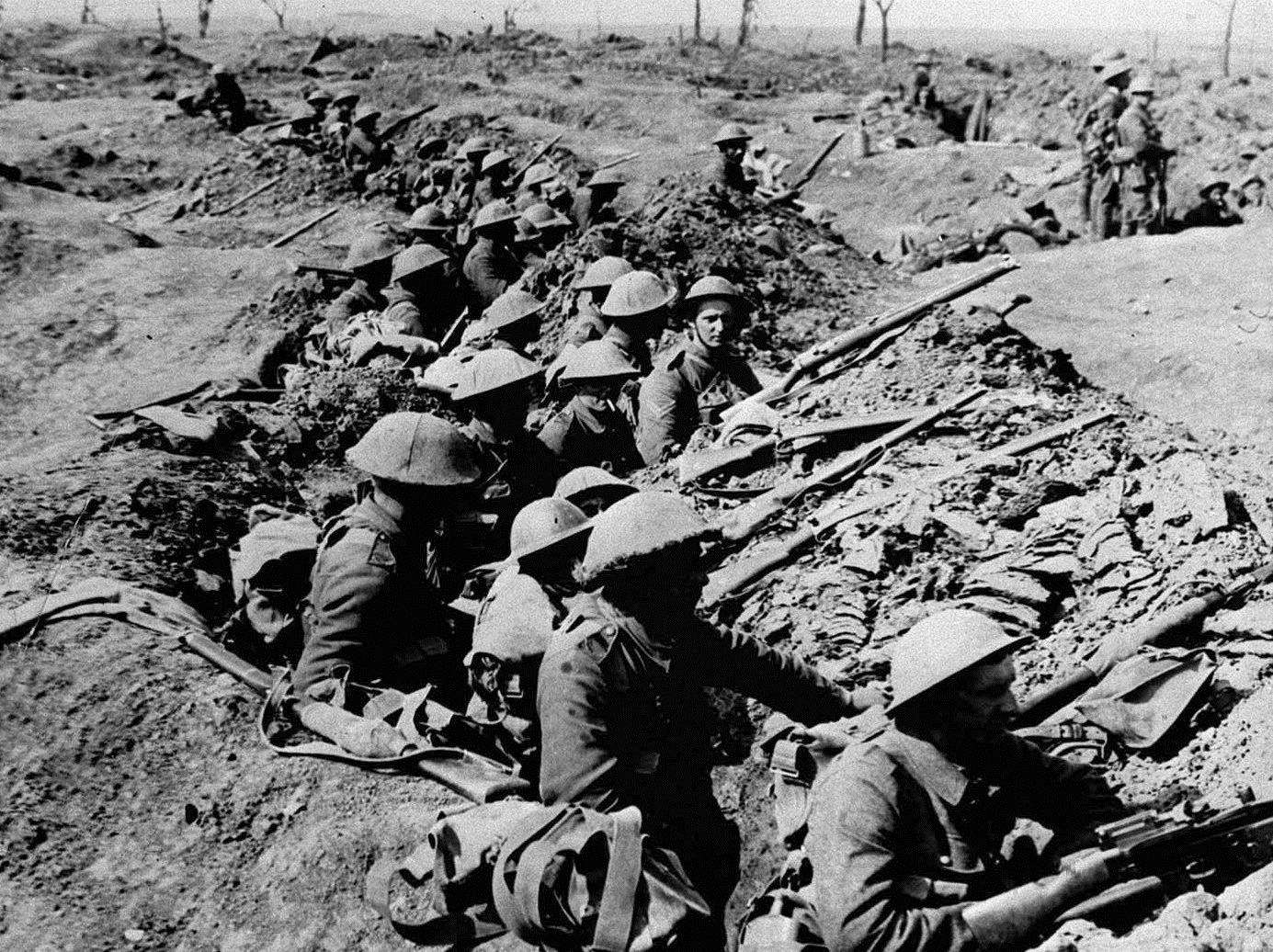 British infantrymen occupy a shallow trench in the Western Front before an advance. Picture: PA First World War collection