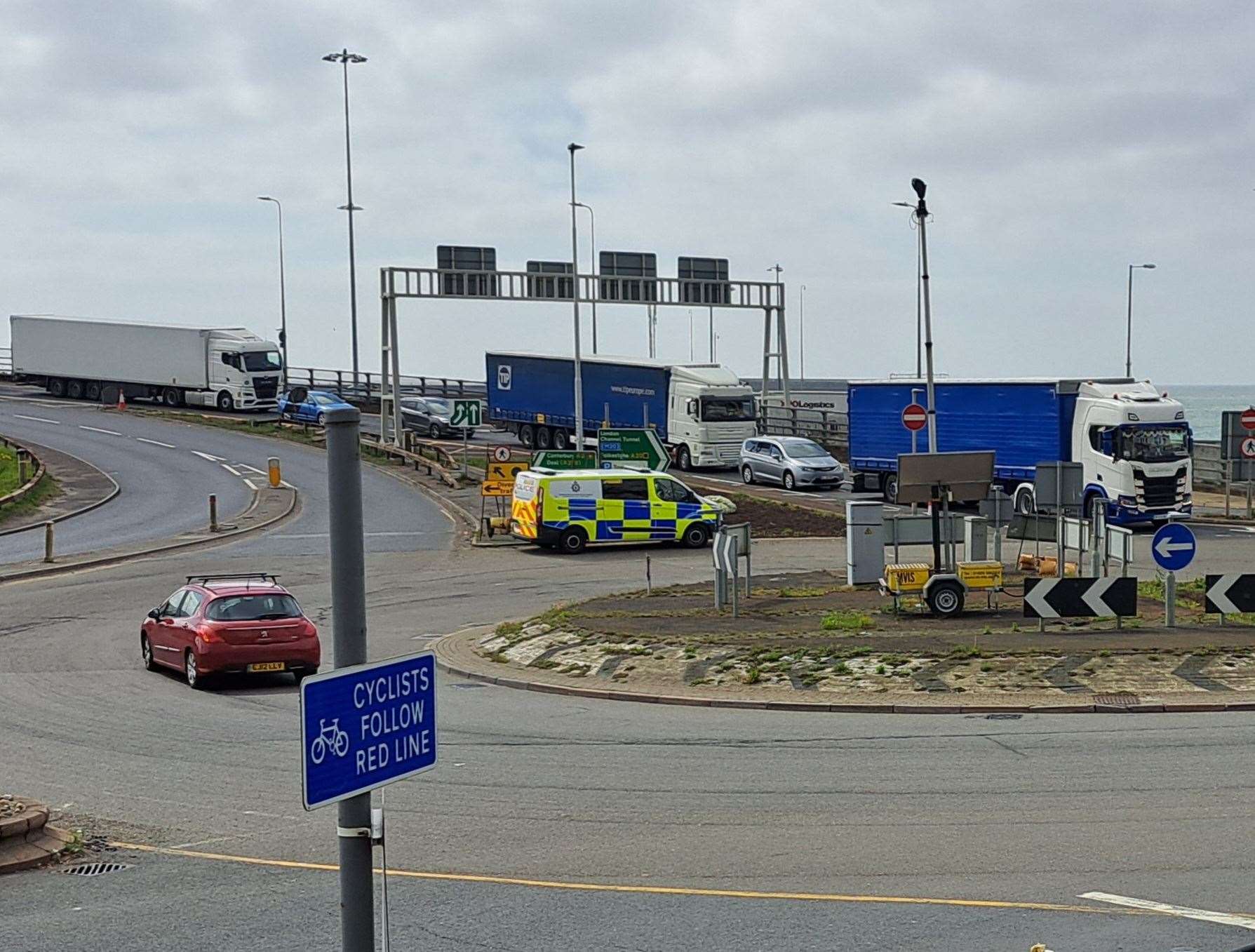 An ambulance is blocked and has to drive on the wrong side of the road on Jubilee Way in Dover to get through port traffic