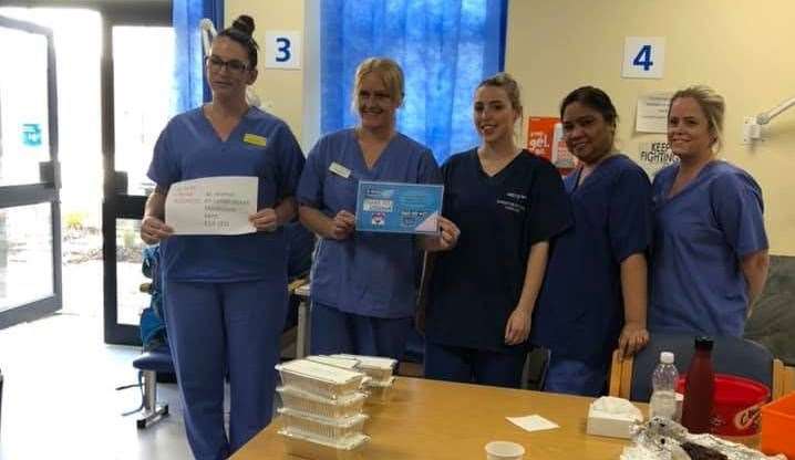 Staff at Maidstone Hospital before digging into their free meals