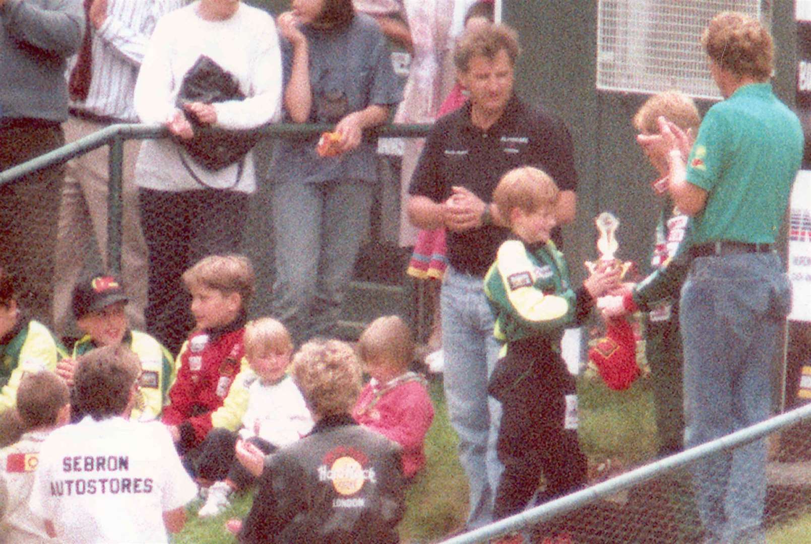 Prince Harry was presented with a trophy from Formula One racing driver Johnny Herbert at the karting track in August 1993. Picture: Press Association/John Stillwell