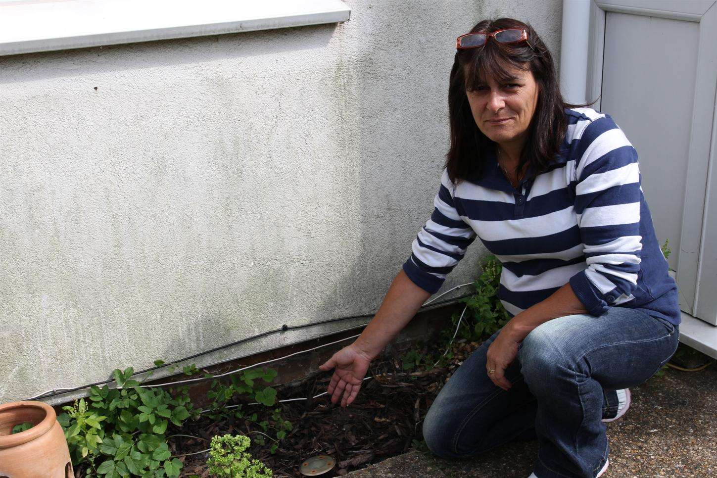 Adele Ankers shows the spot where the gnomes stood before they were taken