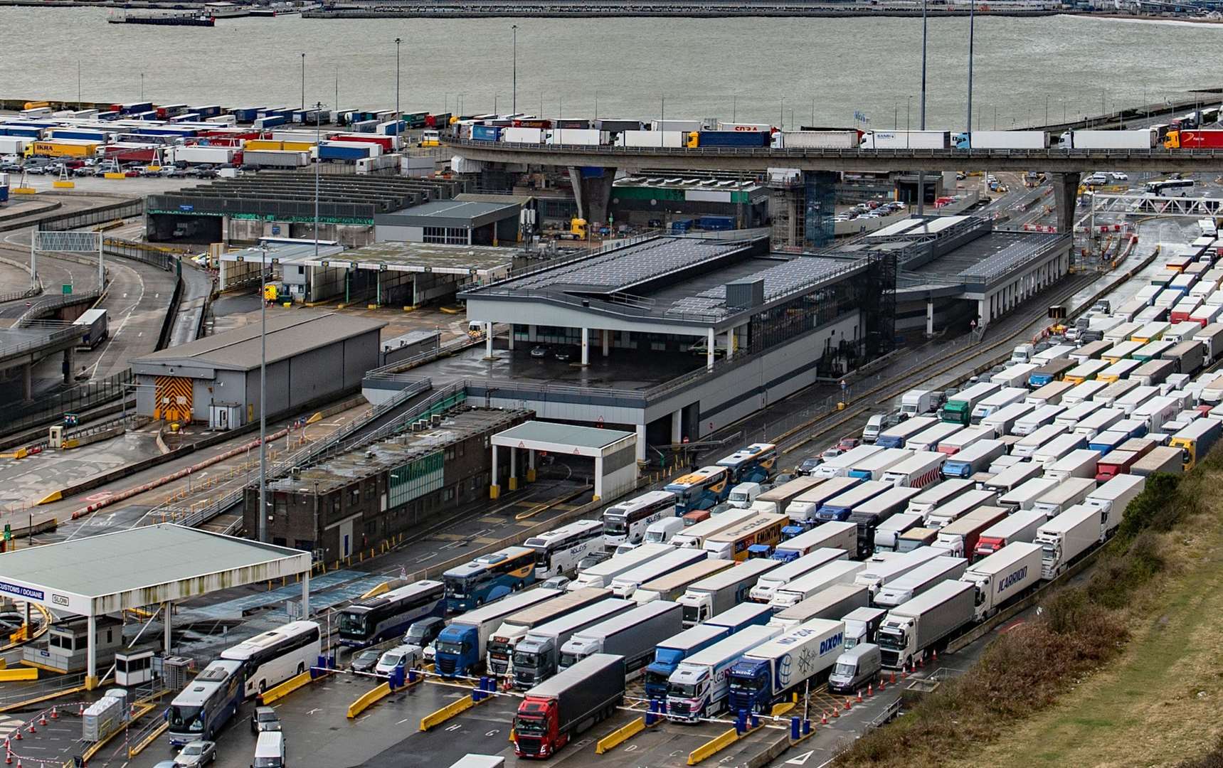 Lorries inside Dover Eastern Docks with others kept waiting on the flyover in Jubilee Way. Picture: Stuart Brock