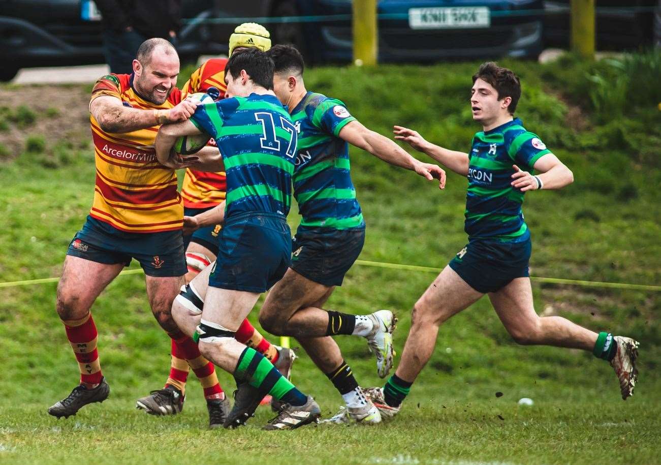 Medway's Tom Beaumont holds off an Old Reigatian challenge. Picture: Jake Miles Sports Photography