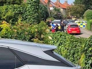 A suspect pictured taken in handcuffs by police on Friday. Picture: Philippa Redding