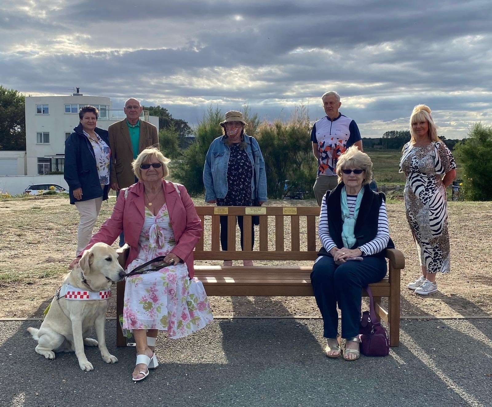 Friends and community members gather at the bench unveiling for Cllr Wayne Elliott