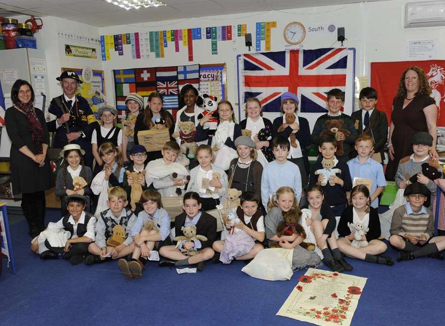 Teacher Ginny Harver, left, ARP warden Peter O'Sullivan, and far right teacher Debbie Foord with the children