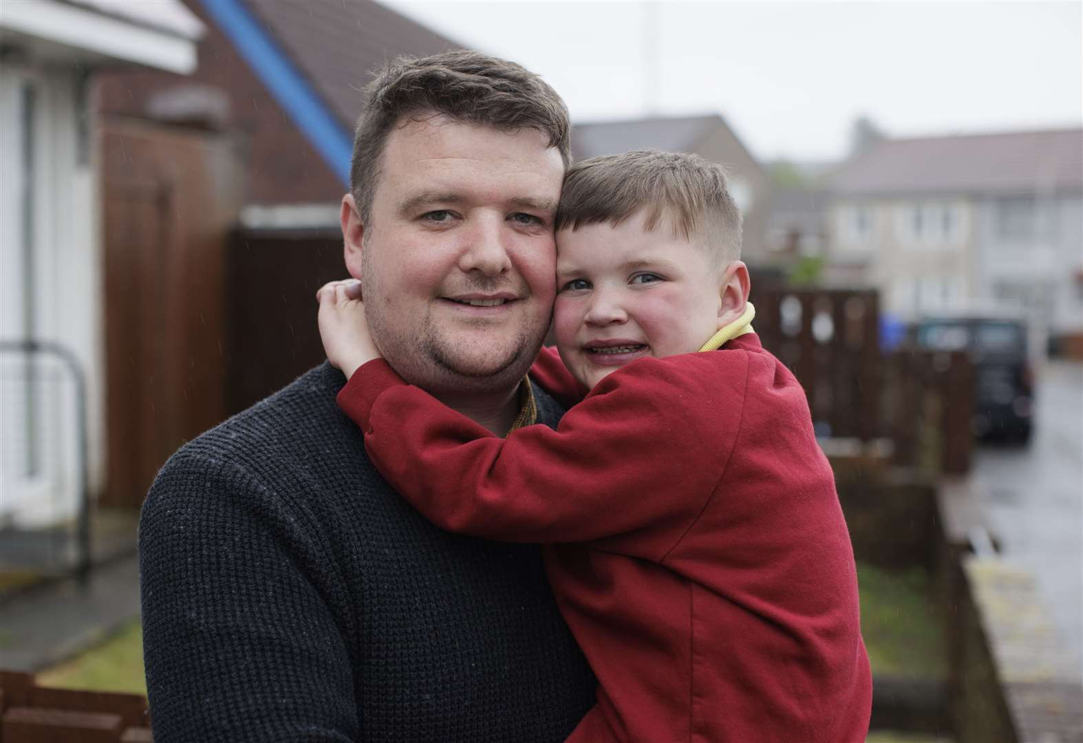 Mairtin Mac Gabhann holding his son Daithi (Liam McBurney/PA)