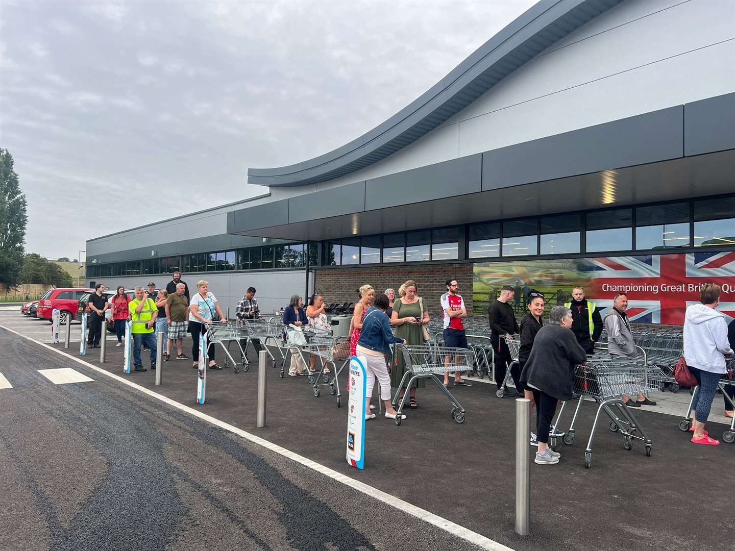 The first shoppers queuing outside the new Aldi store in Queenborough