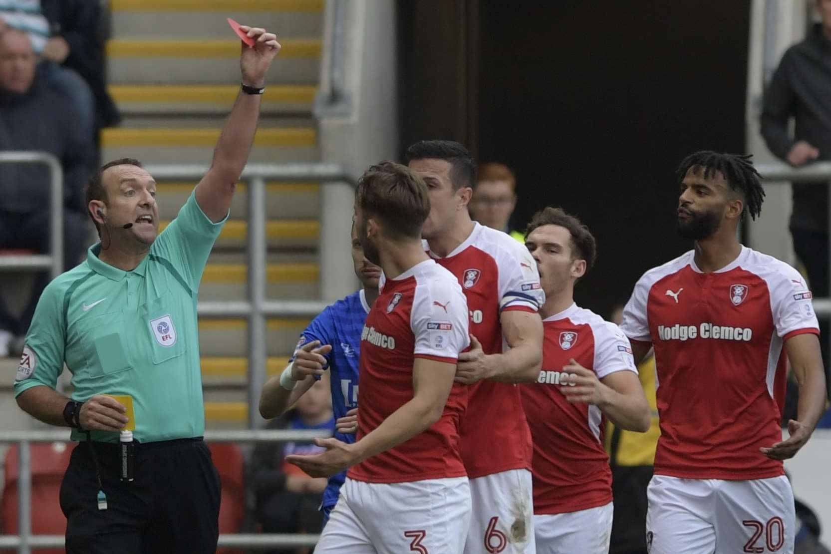 Carl Boyeson shows Rotherham's Joe Mattock a red card during this season's match against the Gills Picture: Barry Goodwin