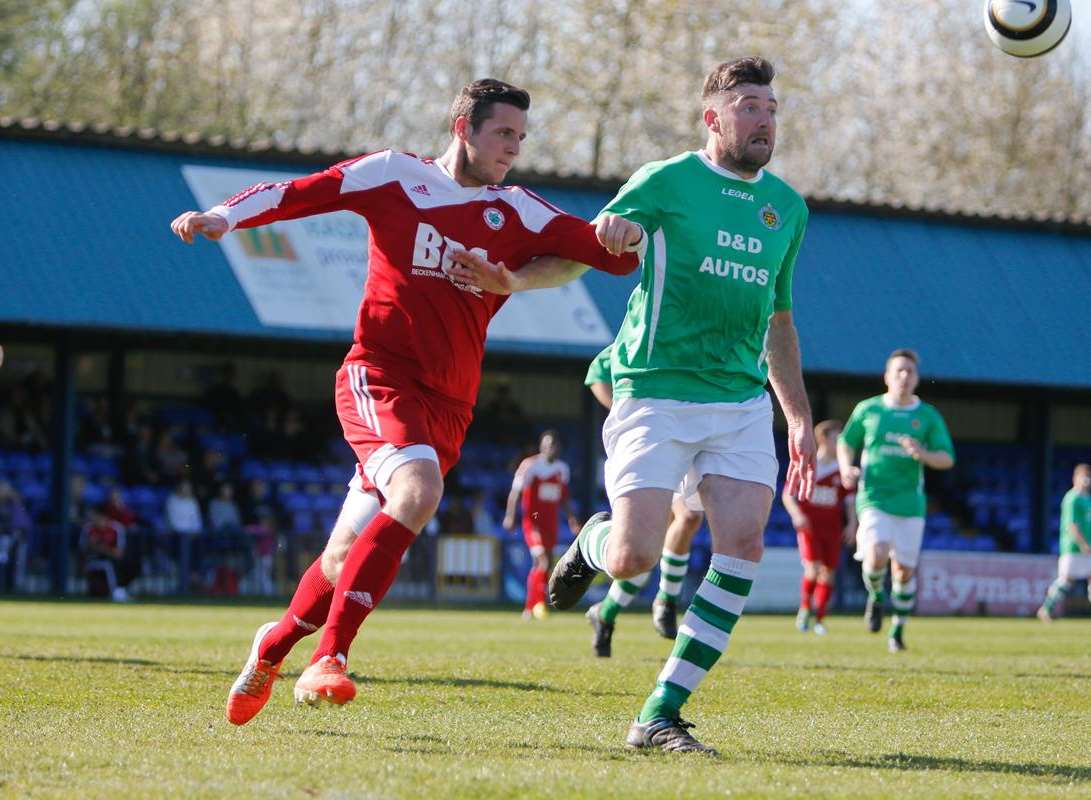 Action from the game between Beckenham (red) and Ashford (green) Picture: Matthew Walker