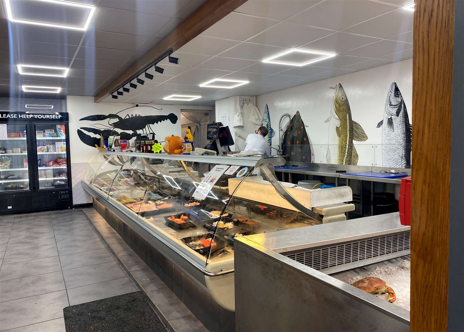 The fishmonger half of the shop has a variety of fresh fish and meat available