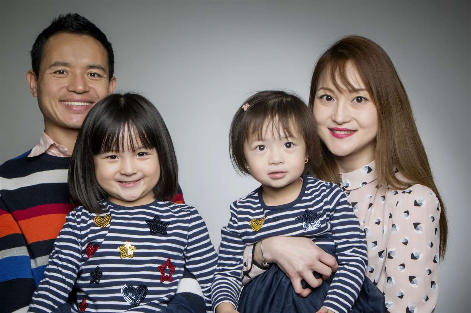 Squadron Sergeant Major Eka Rai with his daugters Elia, eight, Evani, five and wife Homa