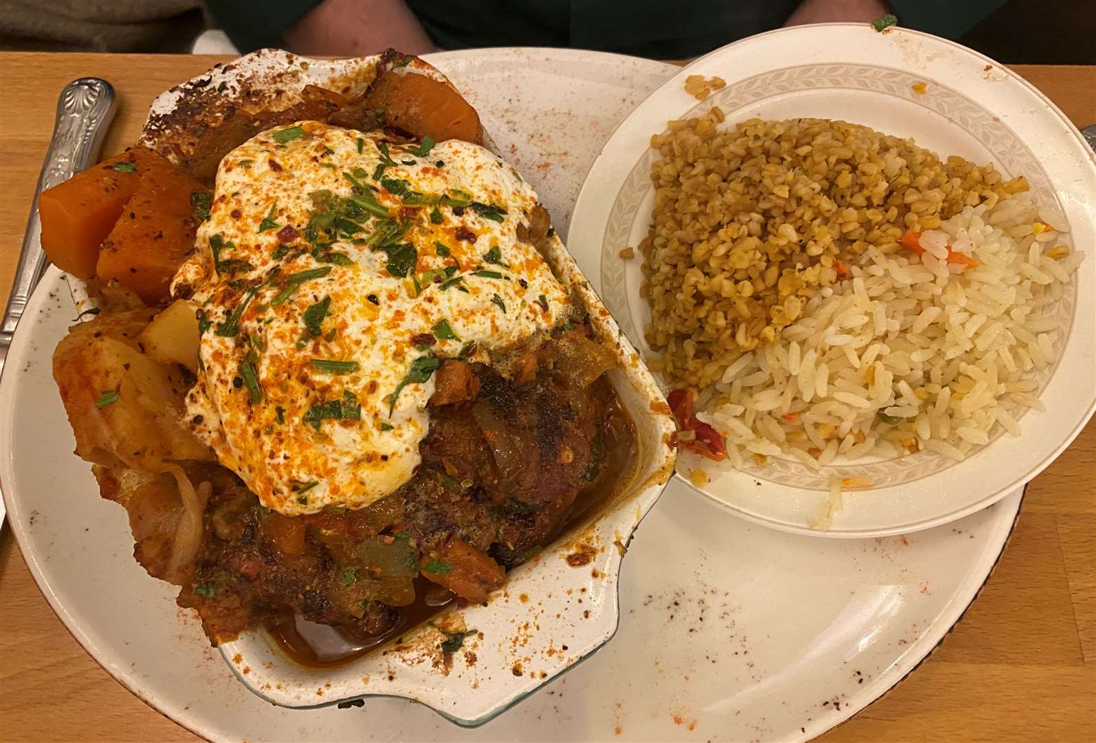 The adana kebab was almost overflowing from the dish served with rice and bulgar wheat