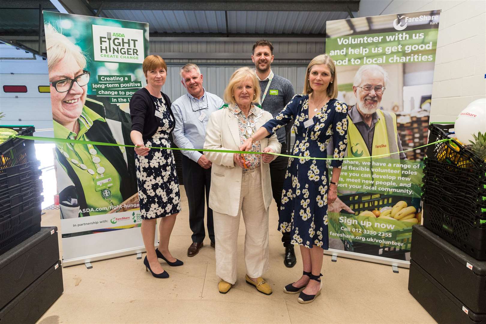 Mayor of Ashford Cllr Jesamy Blanford, assisted by Kent High Sheriff Jane Ashton, right, cut the ribbon of FareShare's new Ashford location (11063078)