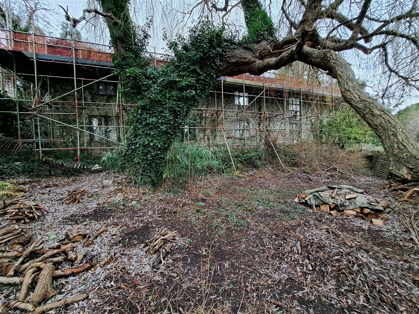 Views of the former oast house, Behind The Wool House in Loose, owned by the National Trust, overgrown and held up by scaffolding. Near High Banks (61707845)