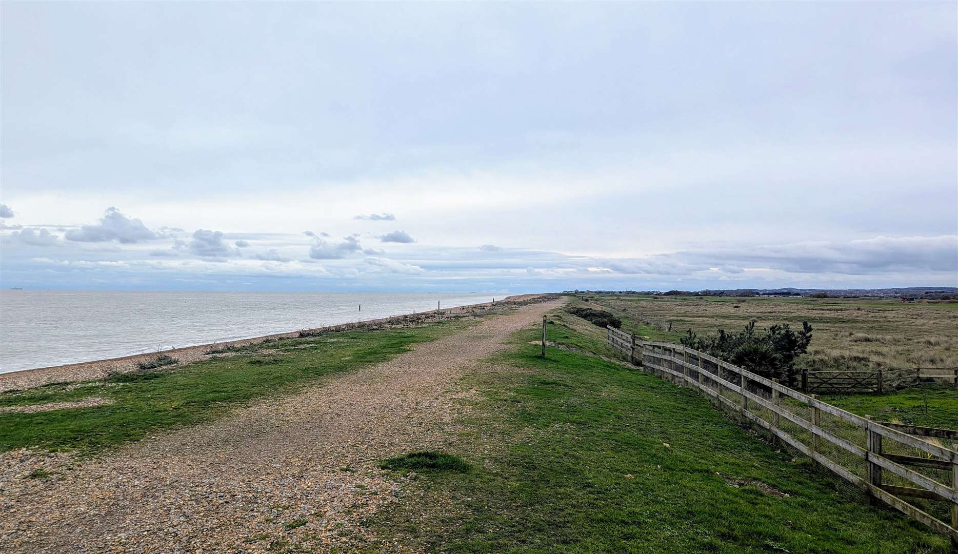 The coastal path is bounded by the sea on one side and golf courses on the other