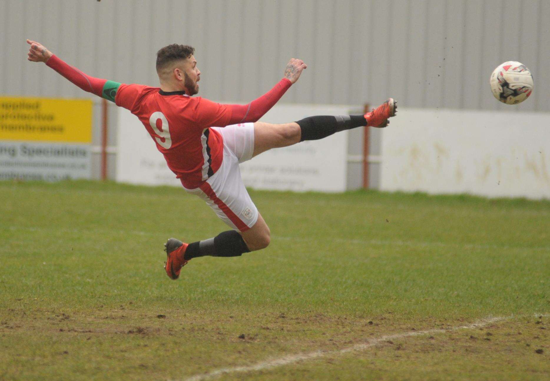 Chatham striker Paul Vines scores one of his four goals against K Sports Picture: Steve Crispe