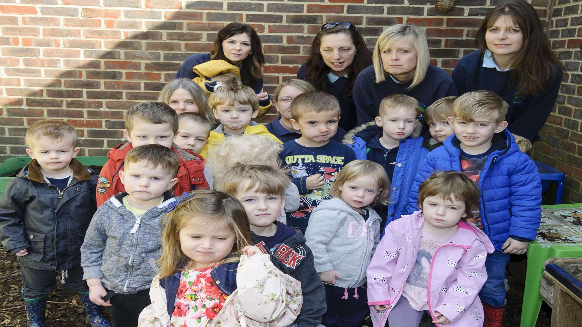 From left, staff Rebecca Cooper, Vicki Fennell, Sarah Coleman, Alison Truss, Julie Edwards and Karen Plaw with children from the nursery