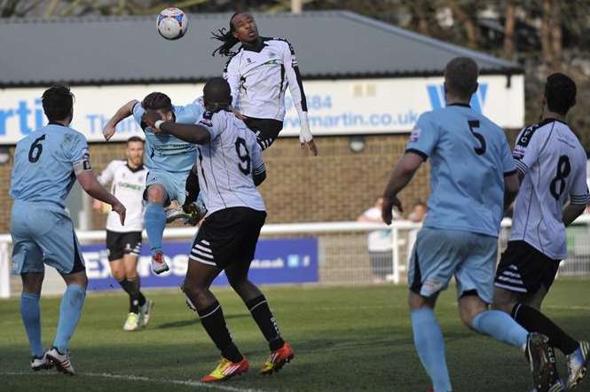 Dover striker Ricky Modeste heads the ball on against Boreham Wood. Picture: Tony Flashman