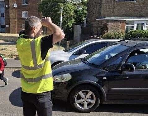 Darren Povey is volunteering as a lollipop person outside Temple Hill primary to help ease traffic problems. Photo: Darren Povey