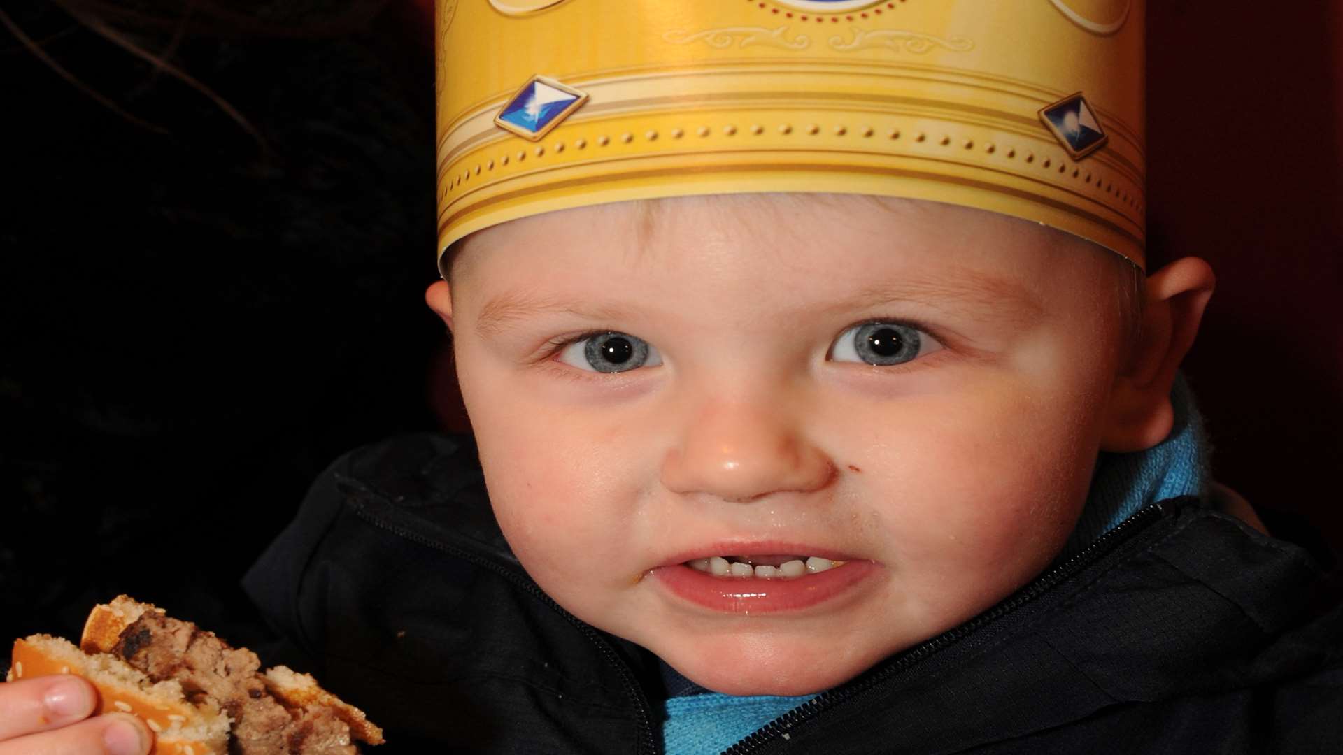 Mason McClean tucks into his burger