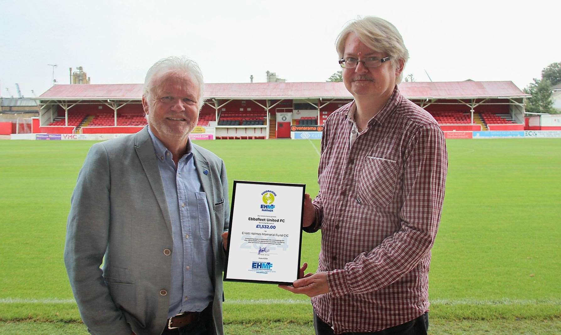 From left: Director of EHMF Peter Scutts presenting a certificate for the £1,532 already raised to the school’s coordinator at Ebbsfleet United FC Phil Moss. Picture: Elliott Holmes Memorial Fund