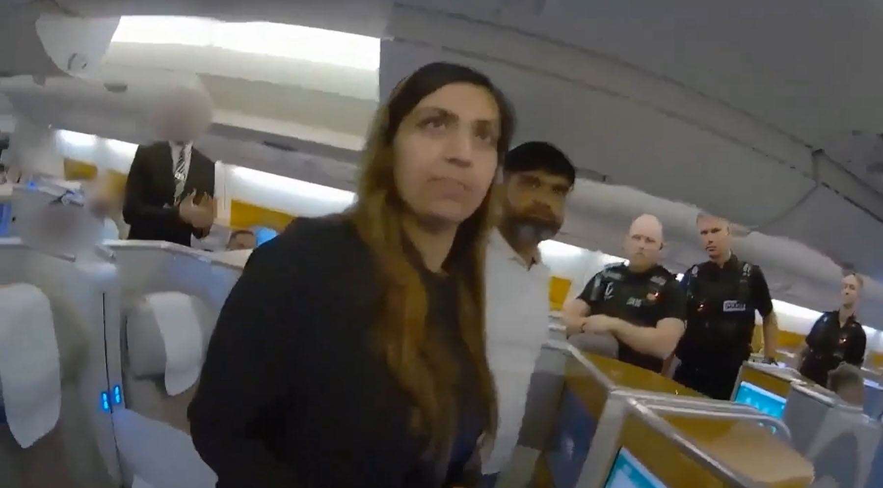 Bodycam footage showed police officers boarding a plane and detaining Beinash Batool and Urfan Sharif at Gatwick Airport (Surrey Police/PA)