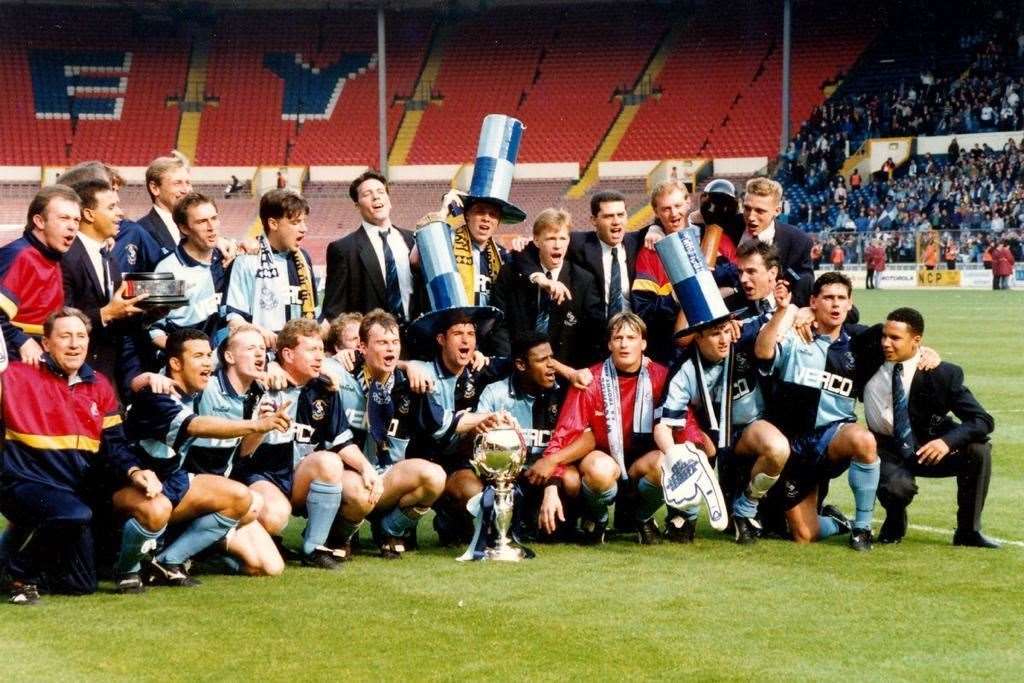 Maidstone boss Hakan Hayrettin, front row, second from left, brought his FA Trophy album along to the Gallagher