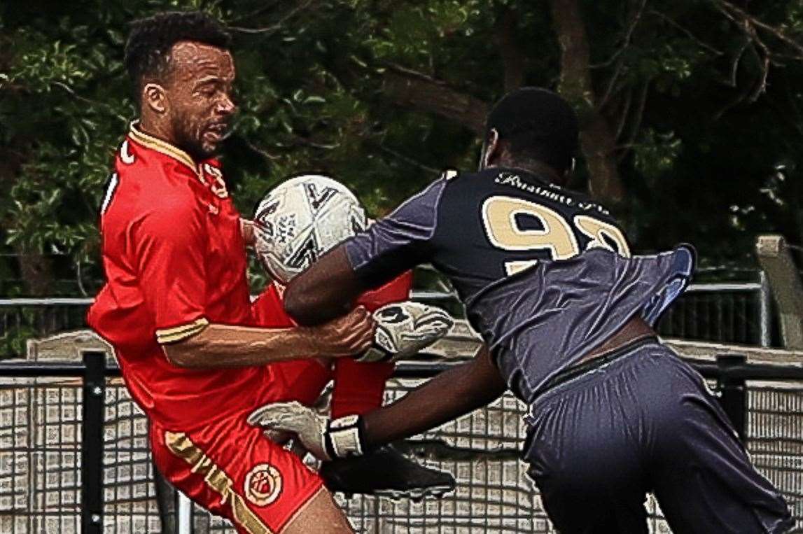 Whitstable’s Karn Miller-Neave challenges with Rusthall keeper Serine Sanneh. Picture: Les Biggs