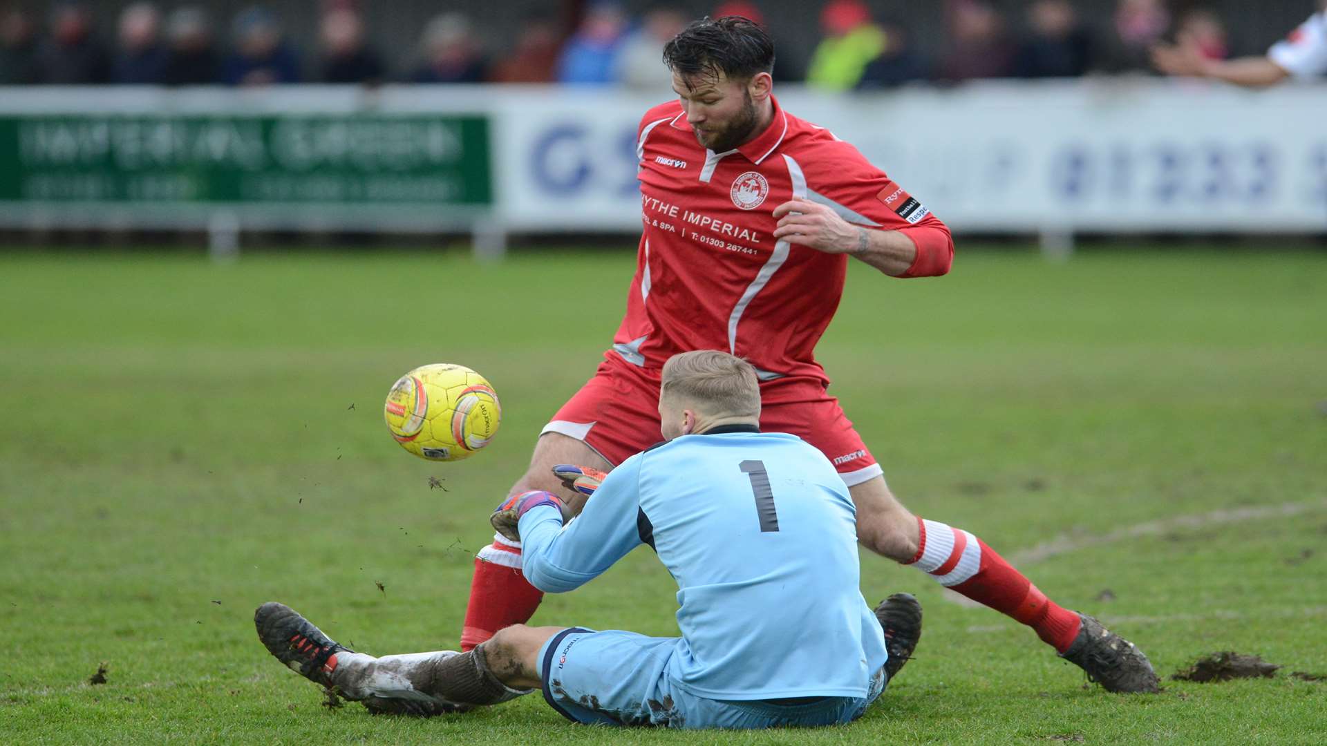 Craig Thompson puts Faversham keeper Rob French under pressure. Picture: Gary Browne.