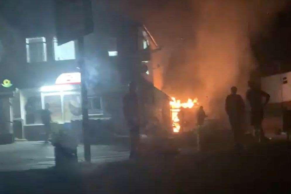 An outbuilding attached to the convenience store in Bull Orchard was alight. Picture: Ben Cooper