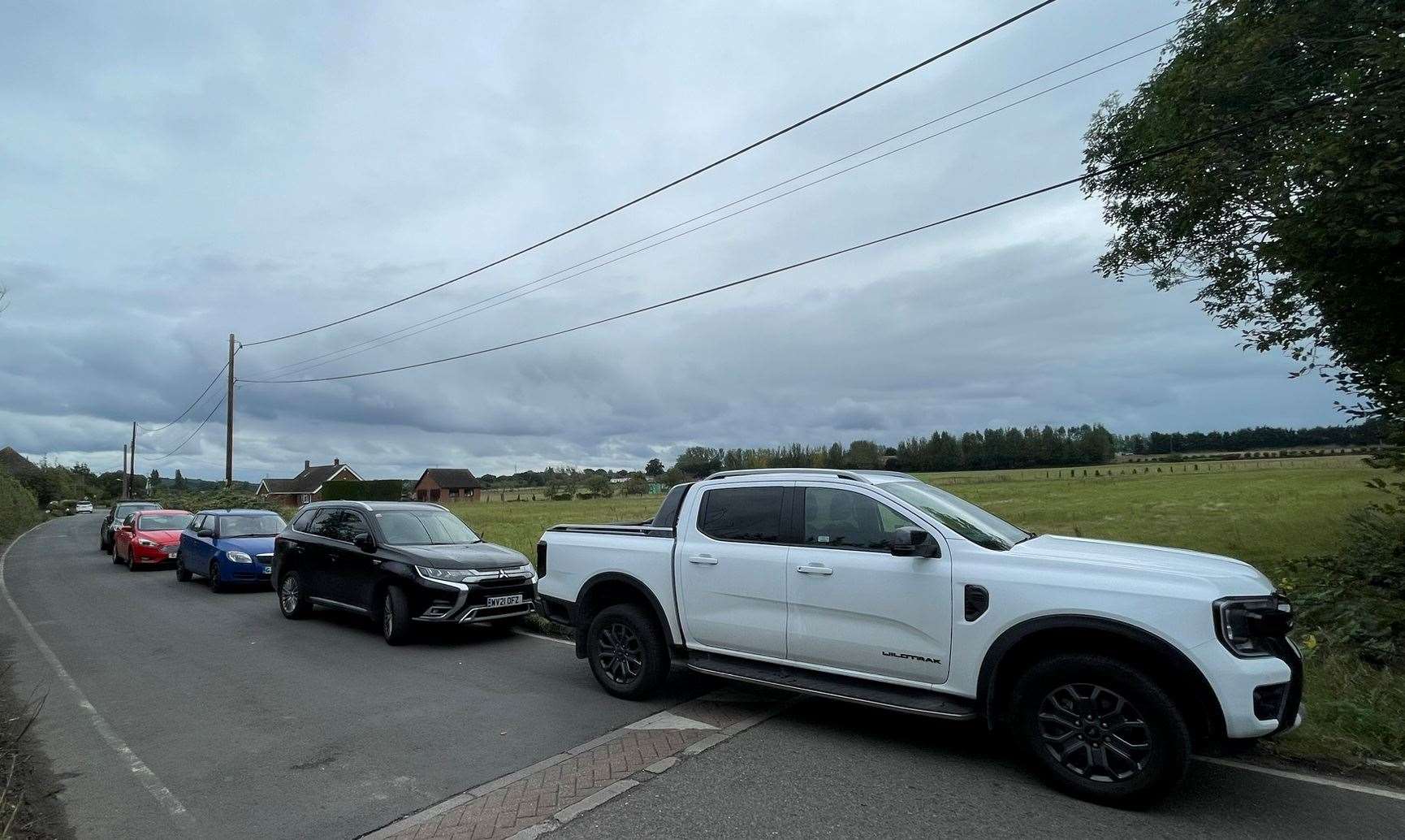 Cars parked in Forge Lane, Upchurch, where the new development would be built. Picture: Joe Crossley