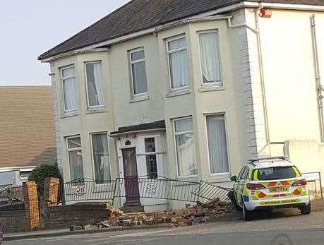 The wall outside the house has been knocked down by the impact. Picture: Mitchell Lawrence