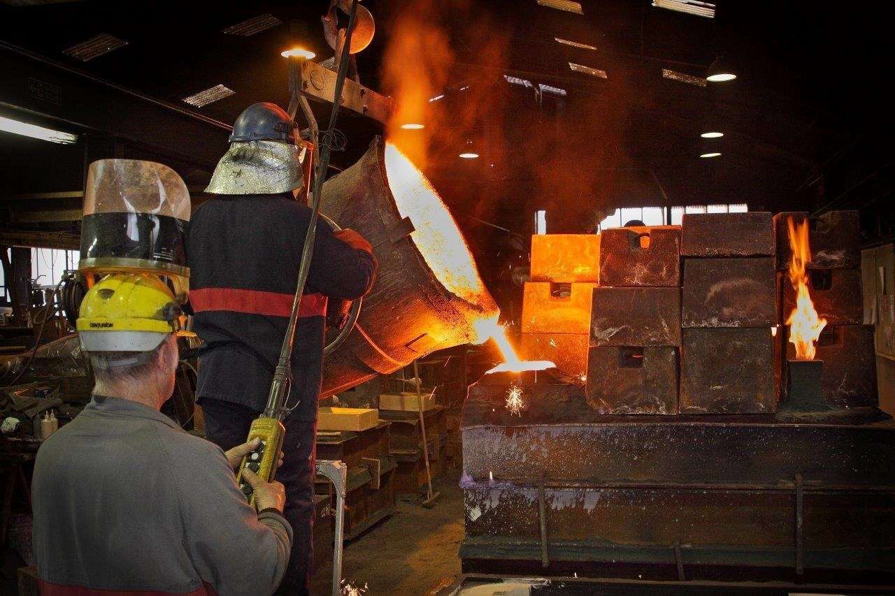 Molten metal being poured into moulds at M J Allen on the Cobbs Wood industrial estate in Ashford