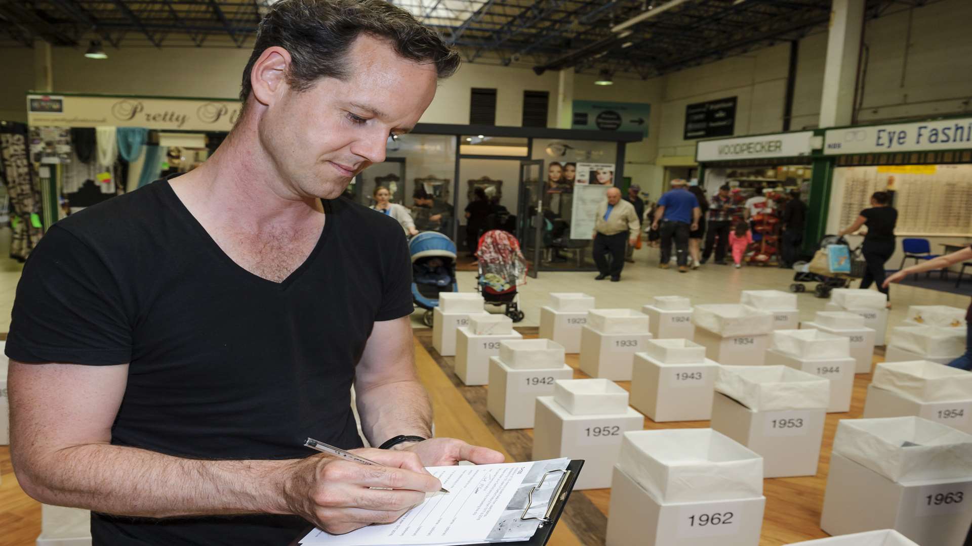 Tony McEwan fills in his Dartford 100 memories form at the main installation.