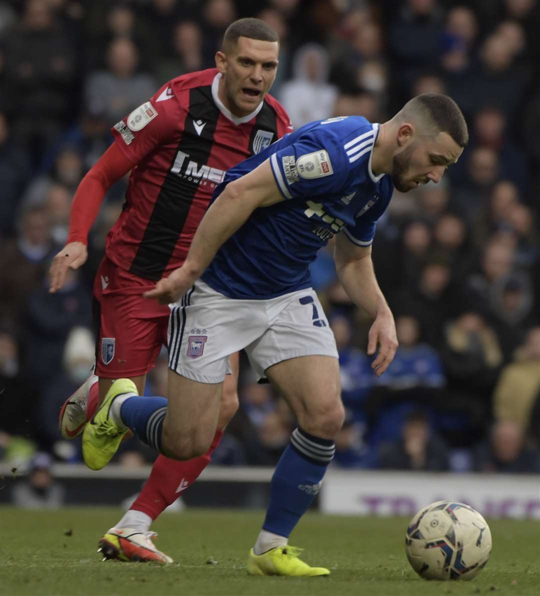 Ipswich's Conor Chaplin breaks away from Gills' Stuart O'Keefe. Picture: Barry Goodwin