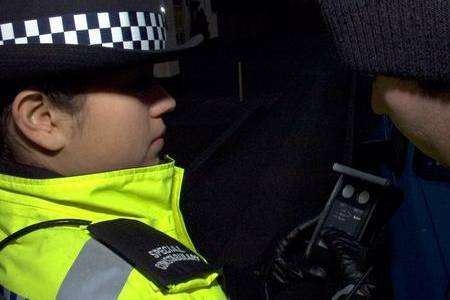 A police officer conducts a breath test. Submitted by Kent Police.