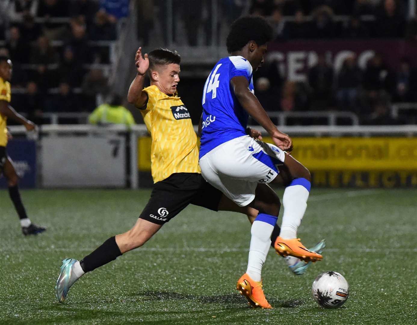 Maidstone’s Riley Court challenges Gillingham man Dami Taiwo. Picture: Steve Terrell