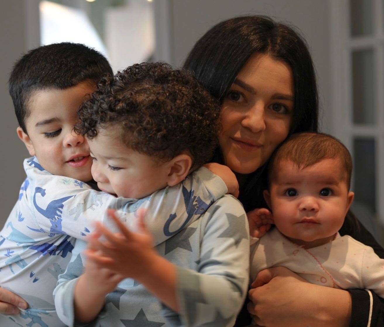 Photographer Jemma Amos with her children Luca, Kai and Sienna. Picture: Jemma Amos