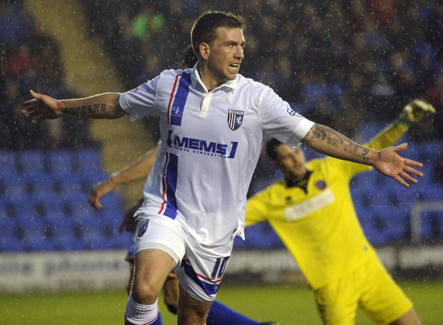 Gillingham's Cody McDonald celebrates scoring at Shrewsbury on Saturday. Picture: Barry Goodwin