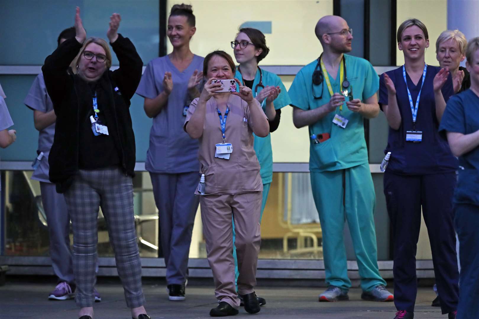 Staff from the Royal Liverpool University Hospital join in a national applause for the NHS (Peter Byrne/PA)