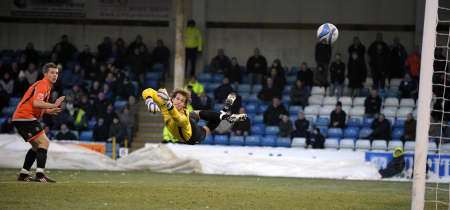 John Nutter's shot flies past goalkeeper Owain Fon Williams for the third goal