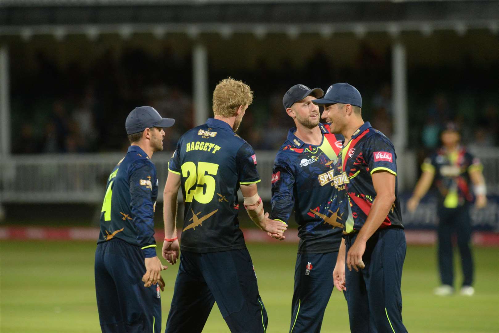 Kent Spitfires congratulate Calum Haggett after he took the wicket of Daniel Lawrence. Picture: Chris Davey.