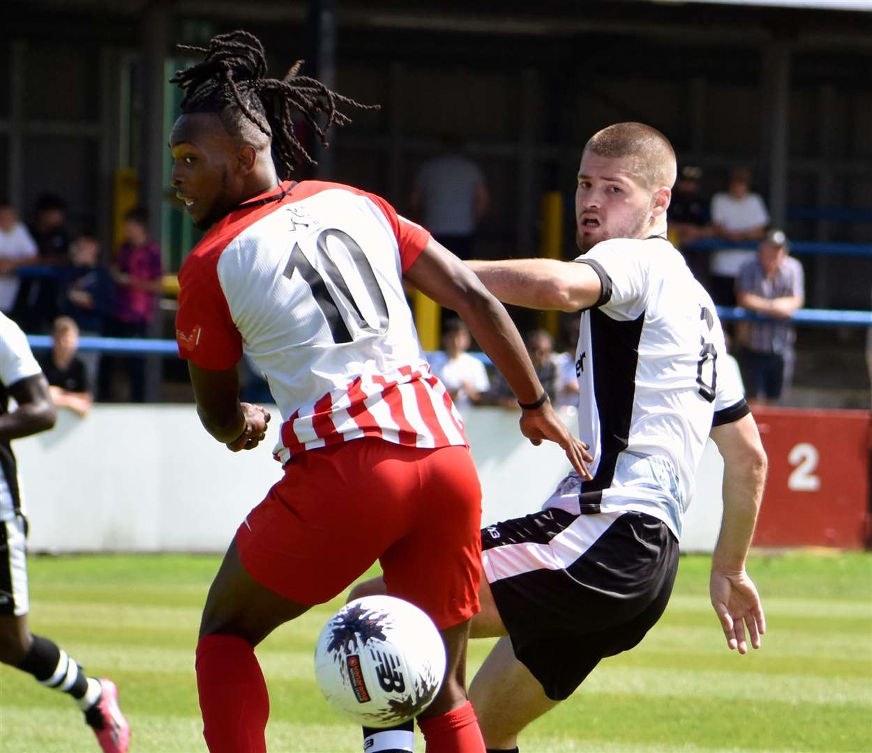 Dover defender Charlie Naylor in the thick of it in a pre-season friendly against Folkestone. Picture: Randolph File