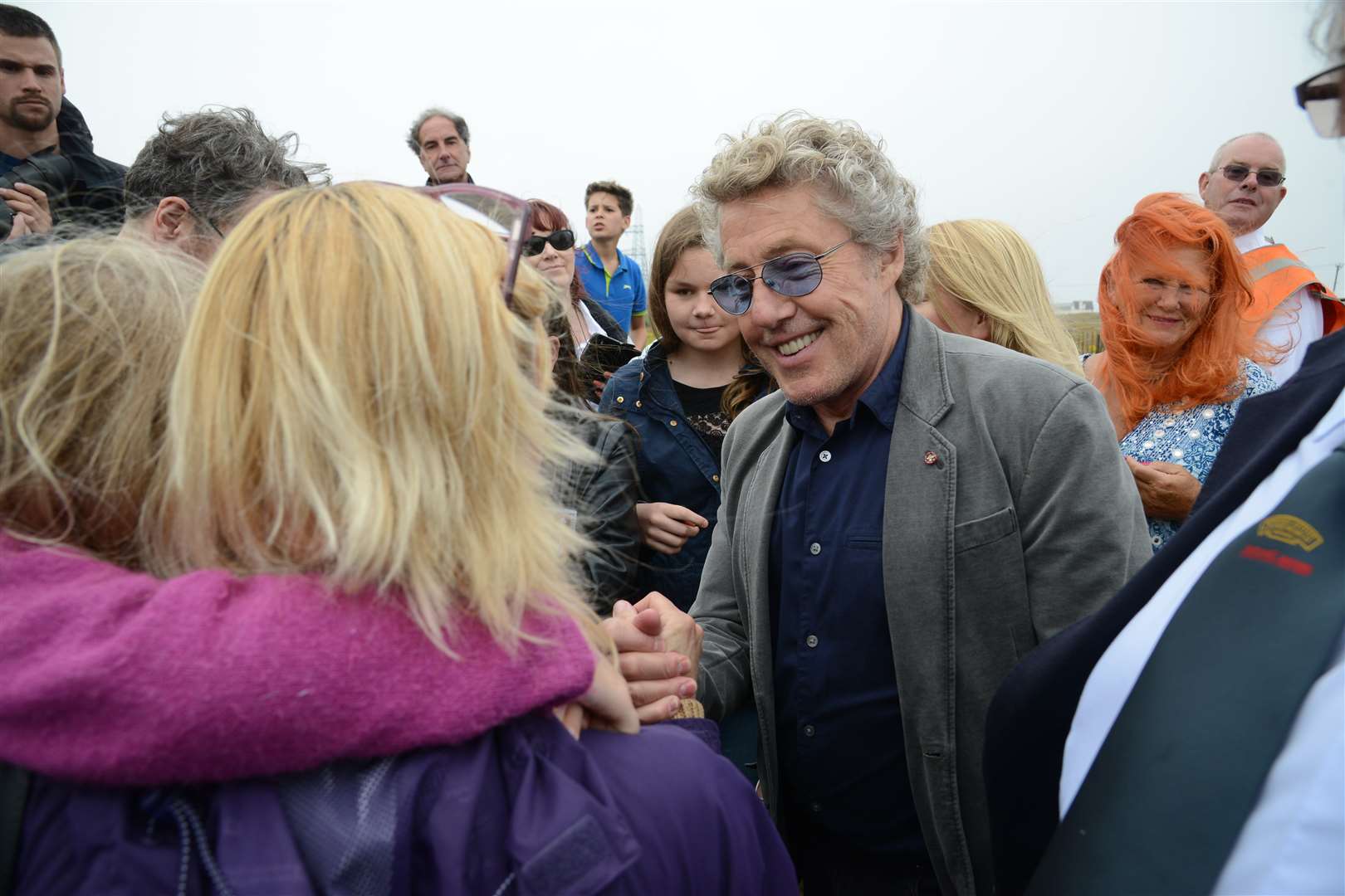 Excited fans mobbed Daltrey as he got off the train