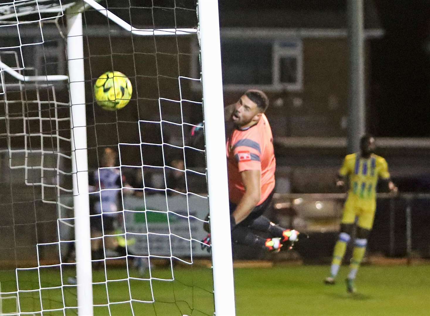 Dover Athletic loanee Matty Holness doubles Deal Town's lead as Sittingbourne keeper Dion-Curtis Henry is beaten. Picture: Paul Willmott